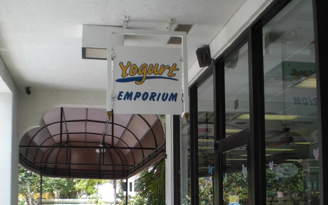 The Yogurt Emporium storefront and sign at Village Tower Shoppes in Boca Raton.